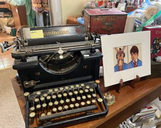 ANTIQUE REMINGTON TYPEWRITER, JEAN COOK OIL PAINTING ON RIGHT SIDE.