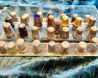 Large collection of sterling and vintage thimbles. 
