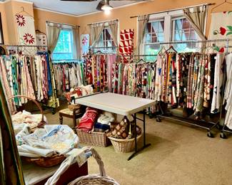 Over 200 quilts, toppers, coverlets. 