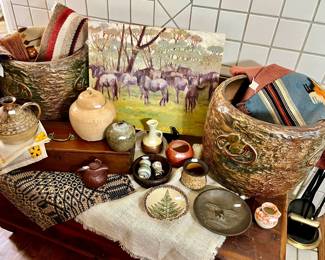 LAYER WITH ANTIQUE TEXTILES, POTTERY.  ON VINTAGE CEDAR CHEST.
