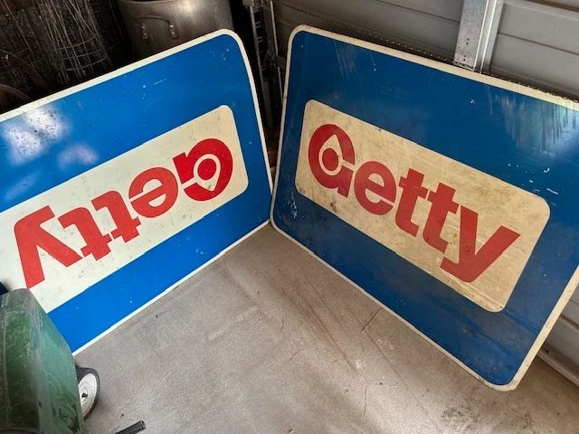 Two Getty gas station signs. Metal.
