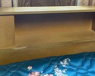 Nice headboard with sliding doors.