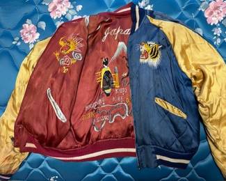 Awesome vintage jacket. Zipper works. Some staining and minor damage. Stunning for its age and embroidery.