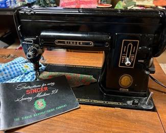 The 301A is the big sister to the 221 featherlight. 1950's. Has the foot pedal.