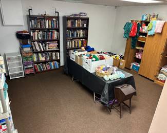 500+ books ( on sewing, quilting, fiction, non fiction, reference) , 100+ bolts of yarn , fabric, 1000+ fat squares 
