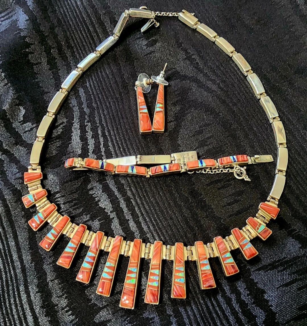 Gorgeous Spiney Oyster and silver necklace designed by artisan Calvin Begay. an award winning Navajo artist who Uses only the finest quality Stones for his creations.