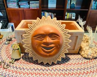 Large terra-cotta Sunburst And large terra-cotta planter