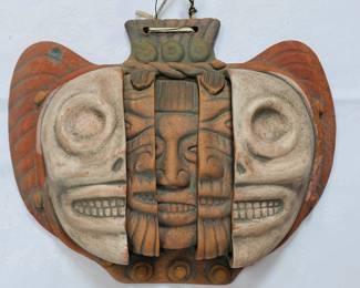 Large pottery, artisanal mask of many faces.