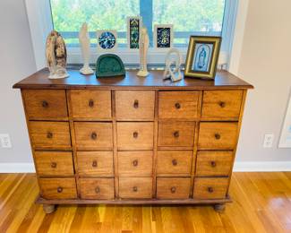 Large Solid wood chest of drawers with multiple drawers. Beautiful Madonna’s and Also a collection of nativities