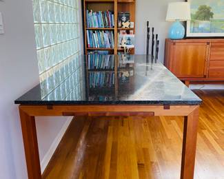 Fabulous grey / black granite topped, teak, dining table with hidden extensions. Gretoma, made in Denmark 120.5” fully extended 80.5 without 