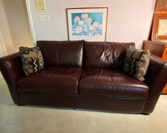 Rich leather sofa with queen sleeper . I don’t think it’s ever been used. This is a lovely piece.
