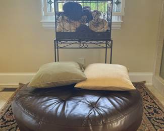 Pottery Barn round leather ottoman, Karastan rug, decorative pillows, Victorian Style metal terrarium with stand