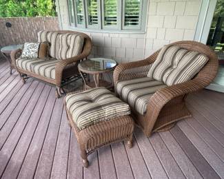 Indoor/Outdoor set:  Glider love seat, swivel glider chair and ottoman, 2 glass top tables