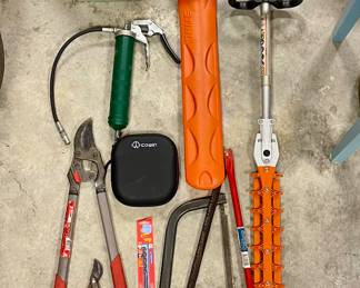 Stihl gas powered trimmers (HS 46C, HL 91K), emergency hand crank radio with cell phone charger, John Deere pistol-grip grease gun, pruning clippers, bow saws, Ford drop hitch for receiver...