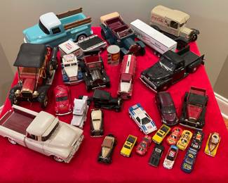 Teleflora 3100 Chevrolet, Wilco Truck and Racer, Ford Model T metal car with AM radio, Shell Value Lubricant small can, Chrysler PT Cruiser, Vintage Tonka Ford Sedan, ERTL Diecast Roadster, General Mills cereal car "pull back and release", Hot Wheels, Volkswagen Bug Taxi, 'Road Tough' 1953 black Ford pickup truck, Vintage cast iron 'Coca-Cola' delivery truck, ERTL 'True Value' piggy bank truck, 'Lowe's Knows Home Improvement' tractor trailer, tin 1908 Ford car, die cast Ford coupe, 1992 Matchbox 'Redskins' car, Mattel Hot Wheels 1977 'Getty' yellow truck (2)...