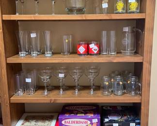 Nice assortment of drink glasses, margarita, martini, beer. Tabasco glass collection, U S Marine Corp glasses, heavy glass ice bucket, Christmas glasses and games.