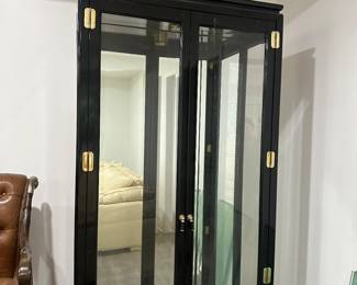 Pair of American of Martinsville black lacquer display cabinets with glass shelving 
