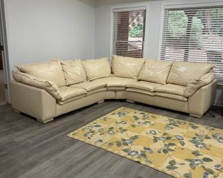 Curved off white neutral leather sectional sofa 