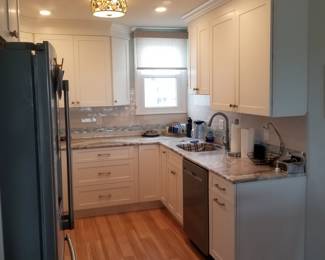 Clean, cute white kitchen with Fabuwood cabinets