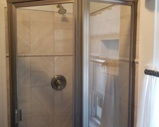 Glass shower enclosure