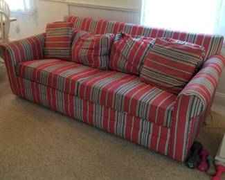 Red, white & blue couch is a sleeper sofa
