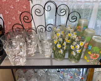Assorted glassware and small metal baker’s rack