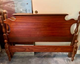 Full bed frame with metal side rails and wooden slats