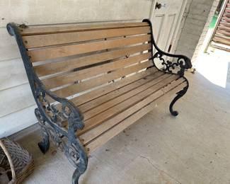 Park bench with lions head arms