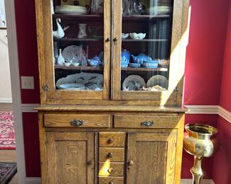 antique oak pie cabinet with screened vents on the side.