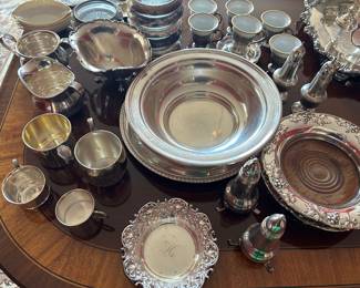 Sterling bowls, cups, salt and pepper, creamer and suger, demitasse cups, bottle coasters