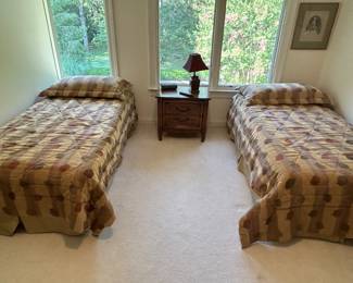 pair of twin beds and nightstand