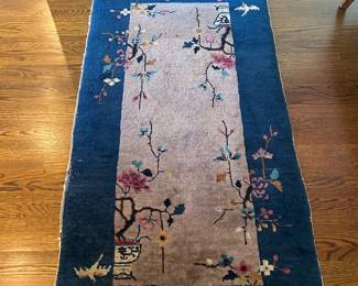 Small Chinese rug in living room - 4'8" x 30"