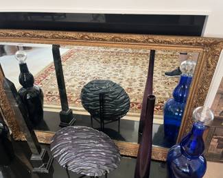 Pre-sell item. Antique heavy gold detailed beveled glass mirror. Excellent condition. Priced at $300.00. 54" wide x 36.5" high.