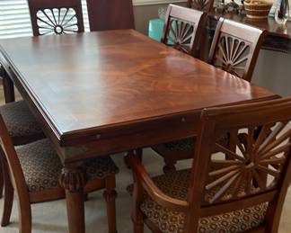 Pre-sell item. Very nice Ashley furniture table w/leaf and 8 chairs. 72" x 42.5" x 30.5" high. Leaf is 18". Priced to sell for 450. 