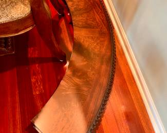 Leaf fits on the outside of the table, keeping the table round not oblong 