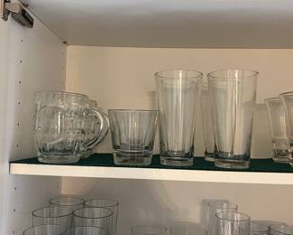 Kitchen filled with many Goodies Glasses Pots Pans Decorative Plates