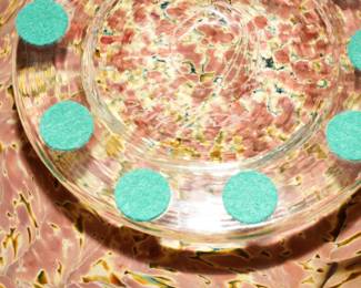 The back of this reverse painted lucite art piece-signed by the artist.