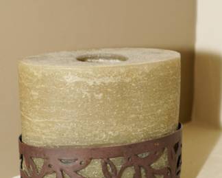 Wrought iron candle holder with pillar candle