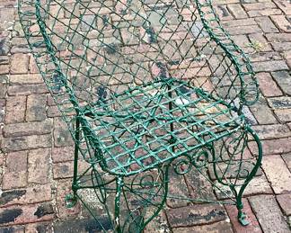 One of 2 antique wire garden chairs