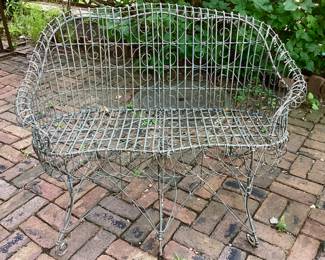 One of two antique wire settees - in the manner of Salterini