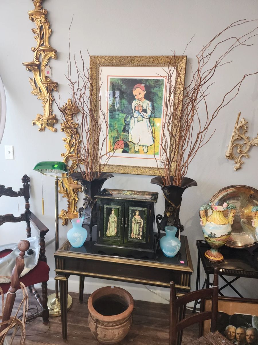 Picasso print with bronze vases on table