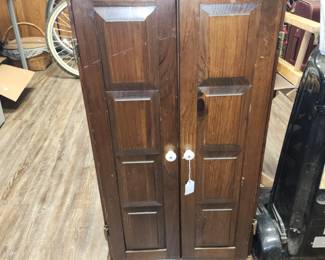 Small wall cabinet with hanging bars