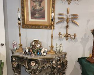 Hand painted entry table. On top, stone egg collection