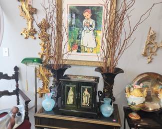 Picasso print with bronze vases on table