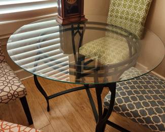Metal and Glass Round Table. 5 Contemporary Chairs. 
