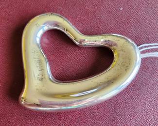 Large Collectible Buckle/Pendant by Elsa Peretti, OMRI OMM, was an Italian jewelry designer and philanthropist as well as a fashion model. Her jewelry and design pieces for Tiffany & Co. are included in the 20th century collection of the British Museum, the Museum of Fine Arts, Boston and the Museum of Fine Arts, Houston.