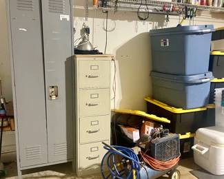 Garage filled with Christmas, furnishings, smoker, pressure washer and tools 