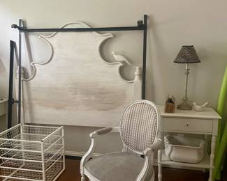 Really unique, cute full size bed with bird. White side tables, lamp and chair