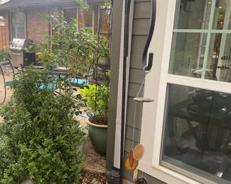 Iron plant hook and cut rock wind chime