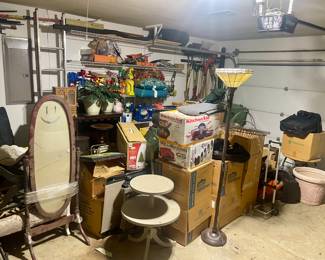 Garage filled with Christmas, furnishings, smoker, pressure washer and tools 